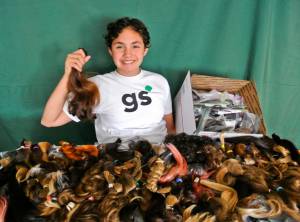 Girl Scout Marieteresa Porcher Allen displays the results of her drive to collect hair for wigs for young people who have lost their hair due to burns, chemotherapy or other reasons. Marieteresa, 11, reached more than double the goal she set to earn a Girl Scout Silver Award &mdash; the highest award for Girl Scout Cadettes &mdash; receiving 239 donations via mail and from city hair salons by the middle of this month. Other members of North Riverdale Girl Scout Troop 1477 are doing remarkable things, like Maya Bliffeld&rsquo;s (age 11) project to donate books for a new library in Guatemala; Laura McEntire&rsquo;s (11) coat drive for people in Breezy Point still affected by Hurricane Sandy; Sophia Moore&rsquo;s (12) project to help women in Togo; and Faith Mulismanaj&rsquo;s (12) plans to paint the benches