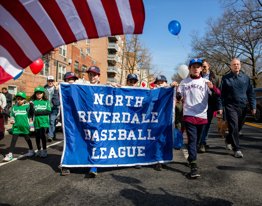 Councilman Andrew Cohen and Assemblyman Jeffrey Dinowitz join members of the North Riverdale Baseball League in a walk down Broadway toward Mosholu Avenue before arriving at Sid Augarten Field in the league&rsquo;s season-opening parade.