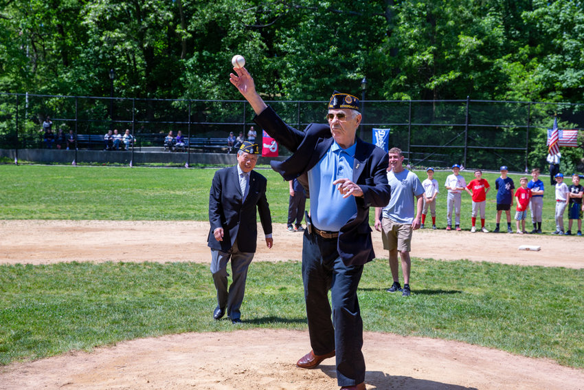 Andy Williams, a veteran and member of American Legion Post 1525, throws one of the first pitches at the North Riverdale Baseball League&rsquo;s fourth annual &lsquo;Salute to Our Armed Services&rsquo; event at Sid Augarten Field.