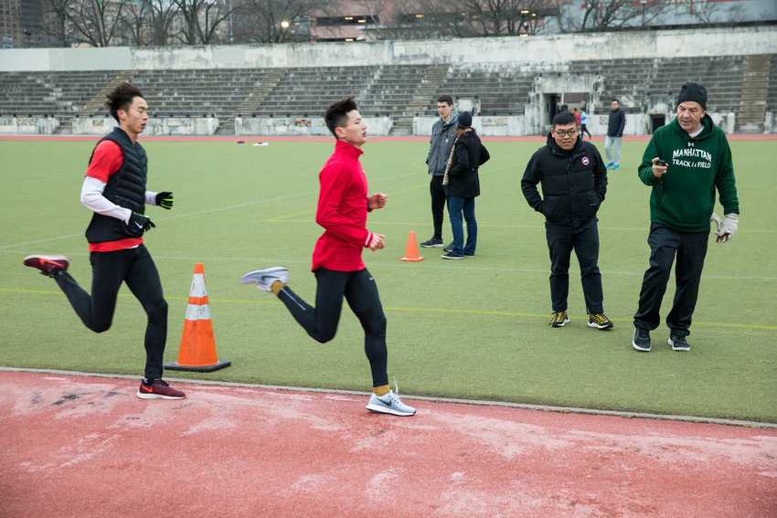 Manhattan College running coach Matt Centrowitz clocks runners from China during a training session at Van Cortlandt Park. A nationally renowned running coach, Centrowitz is training the Olympic-level athletes on his home turf.