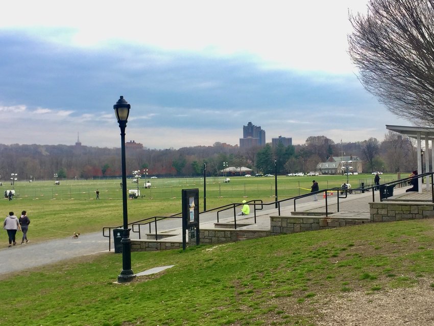 The U.S. Army Corps of Engineers and FEMA erect fencing on the southern third of the Van Cortlandt Park Parade Grounds on Sunday, in preparation for a 200-bed COVID-19 field hospital planned there.