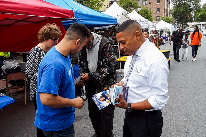 Sammy Ravelo, right, sifts through campaign materials as part of his bid to unseat U.S. Rep. Eliot Engel in the upcoming Democratic primary. Ravelo is in a crowded field of insurgent challengers alongside Andom Ghebreghiorgis and Jamaal Bowman.