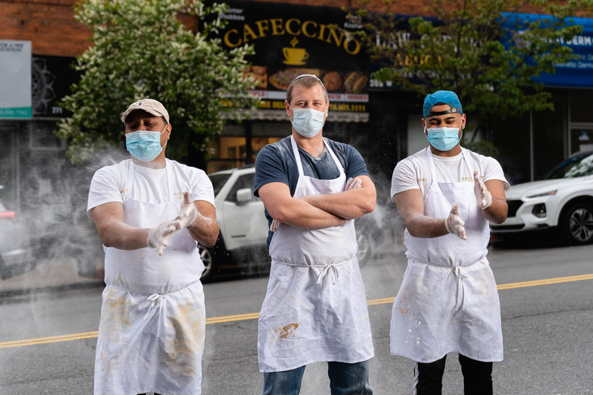 Lukasz Babiuch, center, is the owner of Cafeccino Bakery, which was featured as part of the Bring Back, Give Back Project, which aims to bring attention to local businesses and individuals who still provide services to the community despite the coronavirus pandemic.