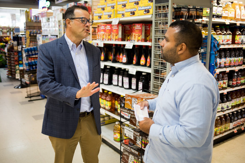 Councilman Andy Cohen speaks with Jaime Luna, the store manager of the Key Food in the Skyview Shopping Center, in 2018.