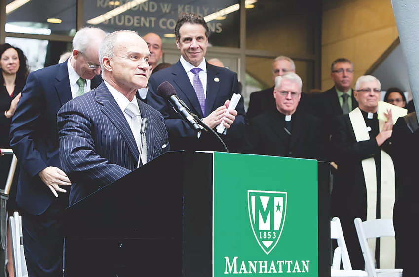 Former New York Police Department commissioner Raymond Kelly gets a standing ovation from Gov. Andrew Cuomo along with others at the 2014 dedication of the Raymond Kelly Student Commons at Manhattan College. Students, however, are now pushing to have Kelly&rsquo;s name removed because of his involvement in the NYPD&rsquo;s controversial stop-and-frisk program.