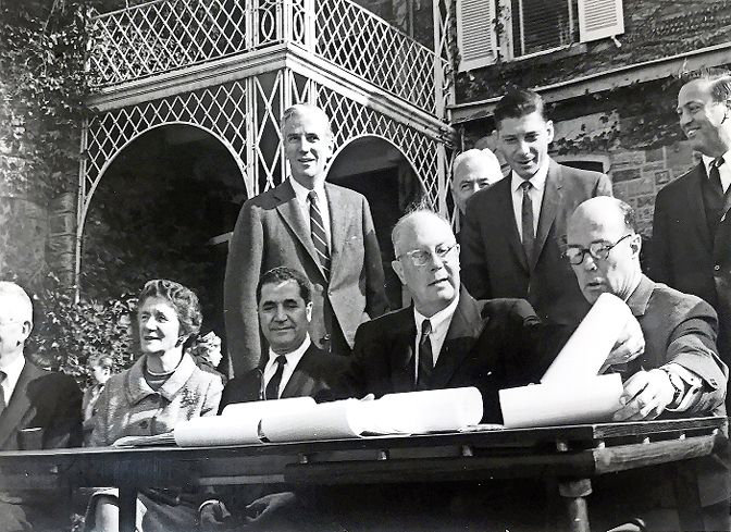 It was all made official on Nov. 4, 1965. City parks commissioner Newbold Morris arranges paper for the official signing creating what would become Wave Hill, joined by Bronx borough president Joseph Pericone and Wave Hill Inc., chair Gilbert Kerlin. Also joining on the far left are is Dorothy Parker Freeman, daughter of former Wave Hill owner George W. Perkins, and her husband, Edward Freeman. Behind them are, from left, U.S. Rep. Jonathan Bingham, corporation counsel David Kranker, and Riverdale Community Planning Association vice president John Mack. Tucked behind Kranker is parks department executive officer John Mulcahy.