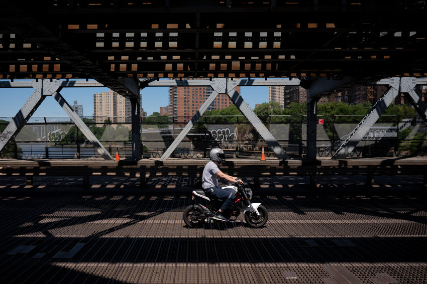 A Bronx-bound motorcyclist on the Broadway Bridge on Wednesday morning, June 23, 2021.