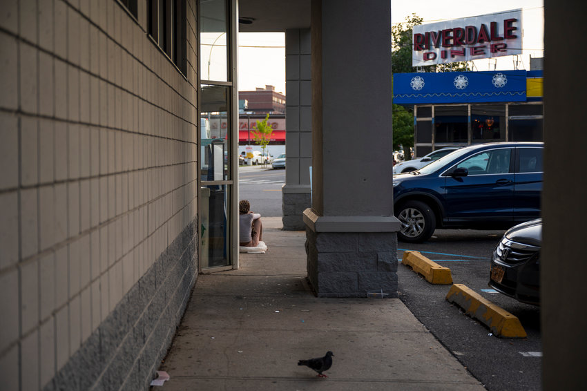 A woman sits outside of the West 238th Street Rite Aid, one of many in the city who are homeless. Some say she could be joined by so many more unless New York&rsquo;s now-expired eviction moratorium is not re-upped. Gov. Kathy Hochul could call for a special session to address the moratorium as early as Wednesday.