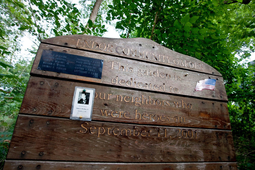 Shortly after the Sept. 11, 2001, terrorist attacks on the World Trade Center, someone constructed a wooden plaque in Fieldston&rsquo;s Endor Garden honoring five local first responders who died that day. But someone stole the display in 2017, leaving it empty ever since. Laura Spalter and others are set to change that Saturday with the unveiling of a new plaque in time for the 20th anniversary of 9/11.