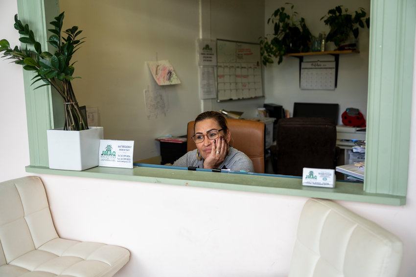 Jackie Maquilon helps her family at the front desk of JMaq Cleaning Solutions on Broadway and West 262nd Street. They have been collectively running the business since her ex-husband died last spring. If the city moves forward with its plan to build a men&rsquo;s homeless shelter at 6661 Broadway, the family would have to part ways with their business location.