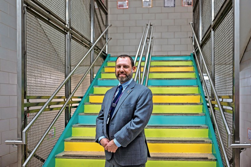 Principal David Weissberg tours the places IN-Tech students painted campus with vibrant colors on March 30, 2022.