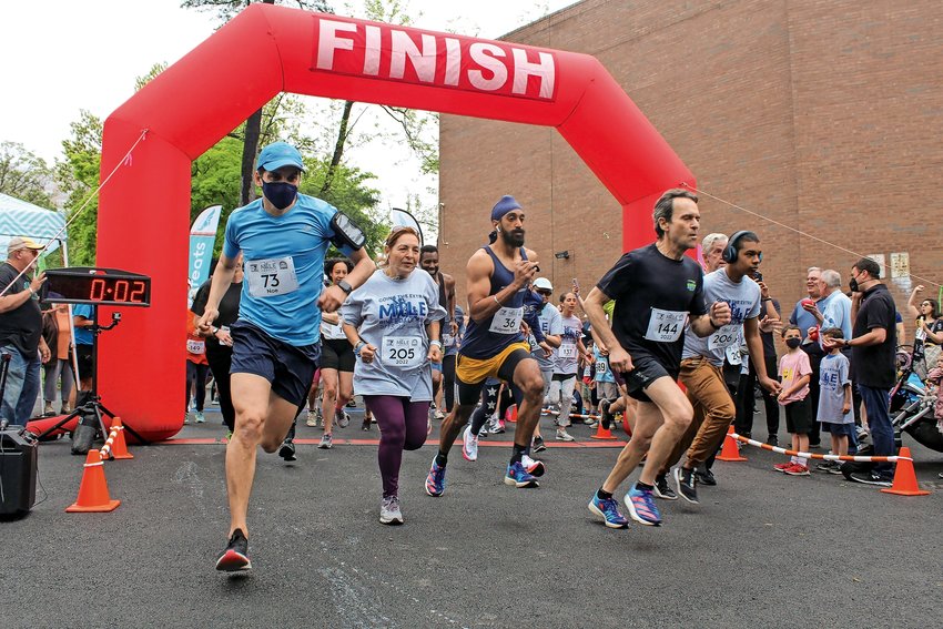 Noe Romo, Morgan Evers, and Balpreet Singh (left to right) cross the start line 2 seconds into the run, The Bronx, Riverdale, May 15th, 2022.
