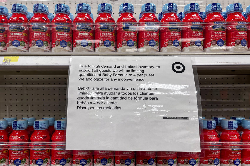 Formula behind locked shelves at the Target in Marble Hill on Wednesday, May 18, 2022. Signs in the aisle note that customers are not allowed to purchase more than four formula products per purchase in light of nationwide shortages.