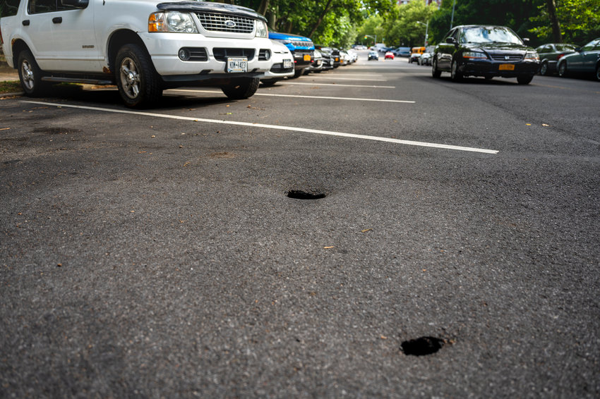 Two holes near the top of Independence Ave near the intersection of  West 247th Street could potentially develop into sinkholes.