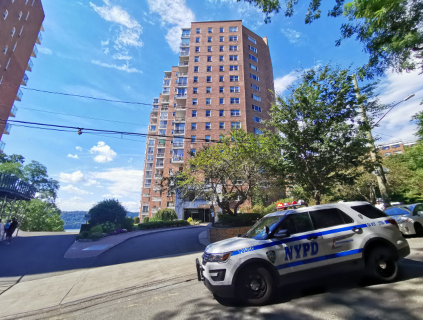 A New York Police Department SUV is parked outside River Terrace Apartments Monday afternoon following the tragic death of Donna Douglas, who was killed by a fallen tree in the residential pool there,