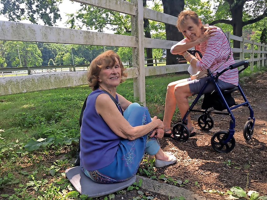 Longtime friends Martha Covi and Mickey Krakowsky enjoy a moment in Van Cortlandt Park near the horses. Mickey recalled as she was sitting with Martha, &lsquo;do you remember when we walked side by side pushing baby carriages? Look at us now. Some 60 years later, we are walking side by side but we are pushing walkers.&rsquo; Martha remembers how she met Mickey in 1956 with their newborns on West 235th Street. &lsquo;I invited her to my husband&rsquo;s birthday party and she accepted. We have been friends ever since then.&rsquo;