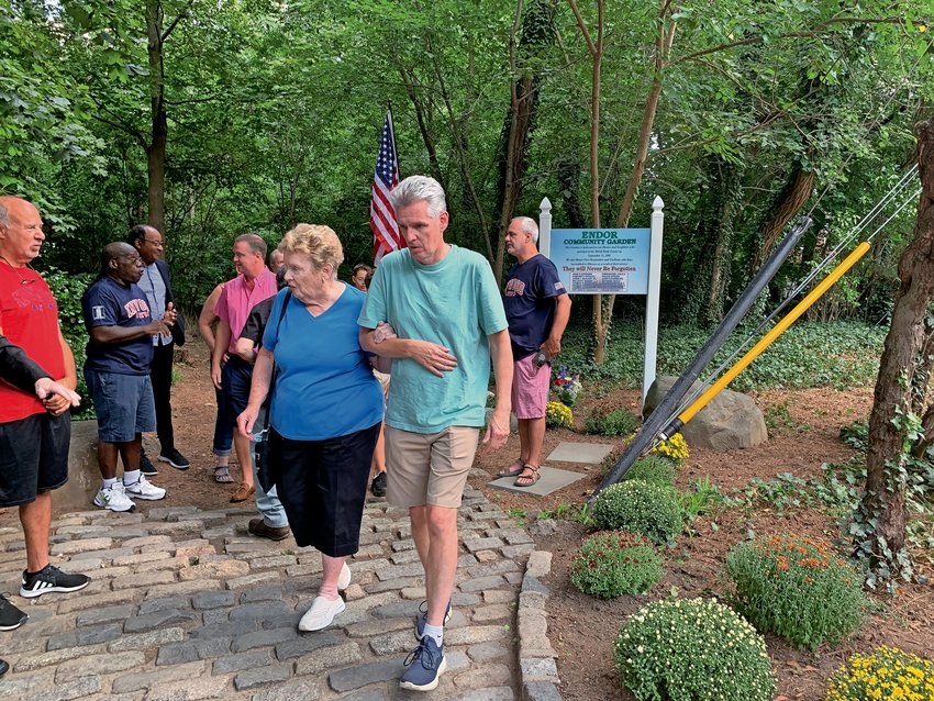 James Joseph McAlary&rsquo;s family walk through Endor Garden near West 253rd Street and Fieldston Road after Sept. 11, 2021 dedication ceremony of a new sign commemorating victims of the Sept. 11, 2001, terror attacks created by students from Riverdale Country School.