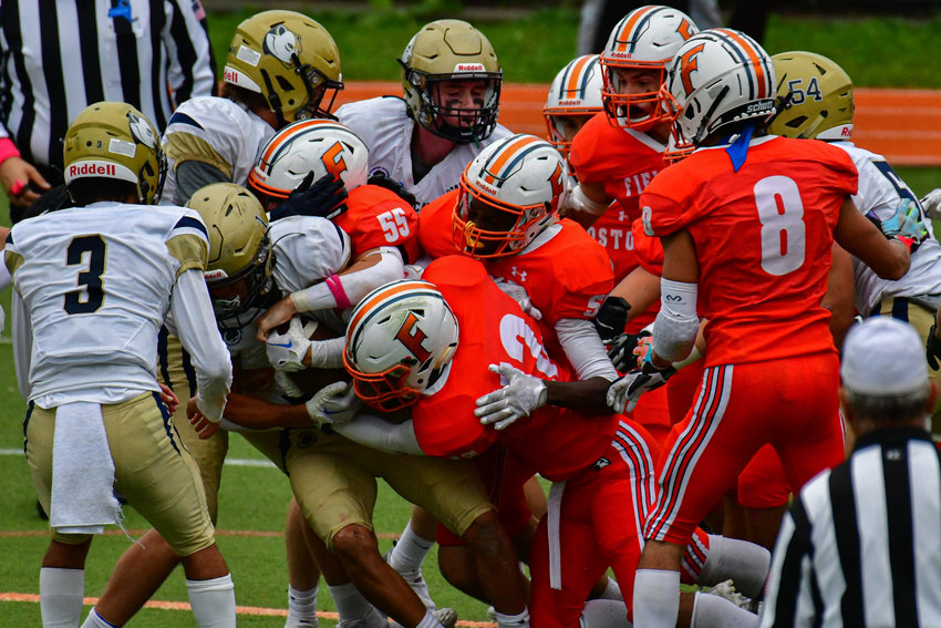 A Rye Country School running back grinds out some yards against Fieldston Saturday in their big 38-0 drubbing of the Eagles.