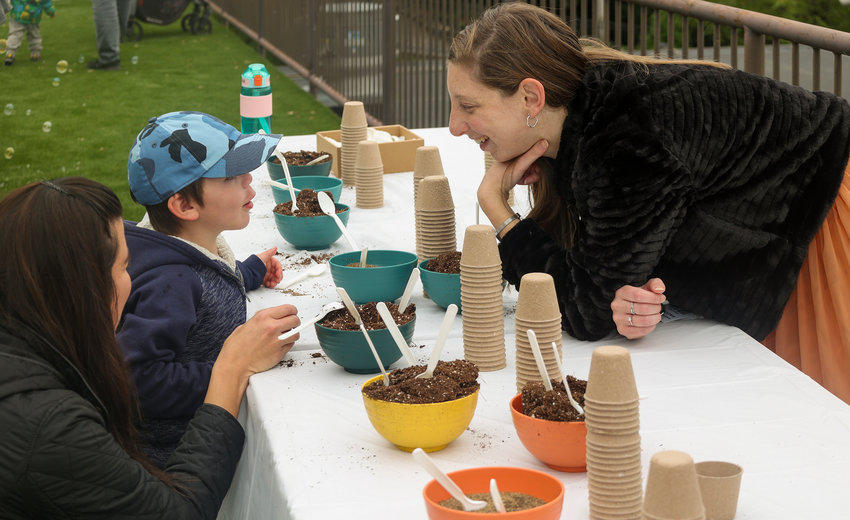 Teacher Noa Rebhun shows students how to plant seeds at The Gan IIan Family Day event at SAR Academy in Riverdale, New York, Oct 24.