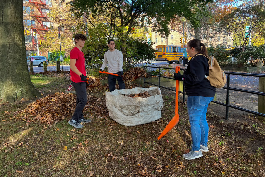 Members of the Manhattan College Student Veteran Organization and track team gather together Nov. 4 to collect leaves at Van Cortlandt Park&rsquo;s Memorial Grove, a living memorial for fallen Bronx soldiers.