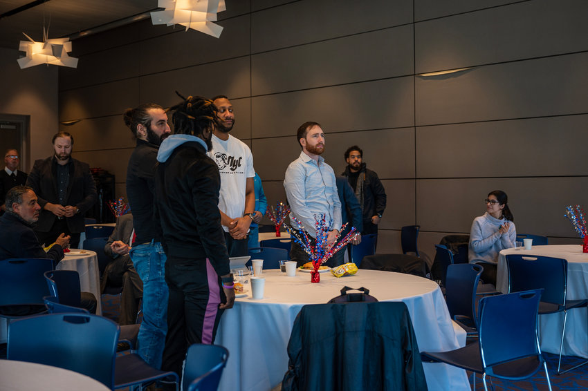 Student veterans stand to be recognized at a luncheon in Manhattan College&rsquo;s Raymond W. Student Commons building on Nov. 14. One of the students, Chris Norberto, is president of the college&rsquo;s Student Veterans Organization.