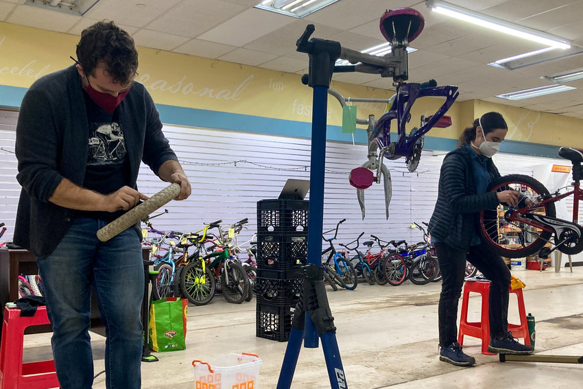 Isaac Rose and Em Hirsch have been volunteering their time to help repair several bikes that were found in an abandoned cycling shop in Manhattan.