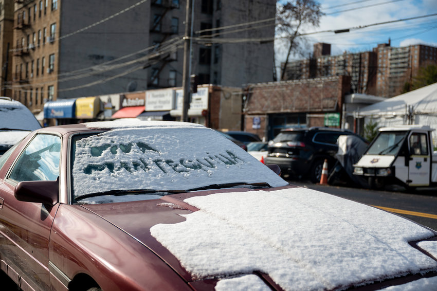 The words &quot;Viva Mantequilla&quot; written in snow on a car parked in Kingsbridge on Dec. 12, 2022.