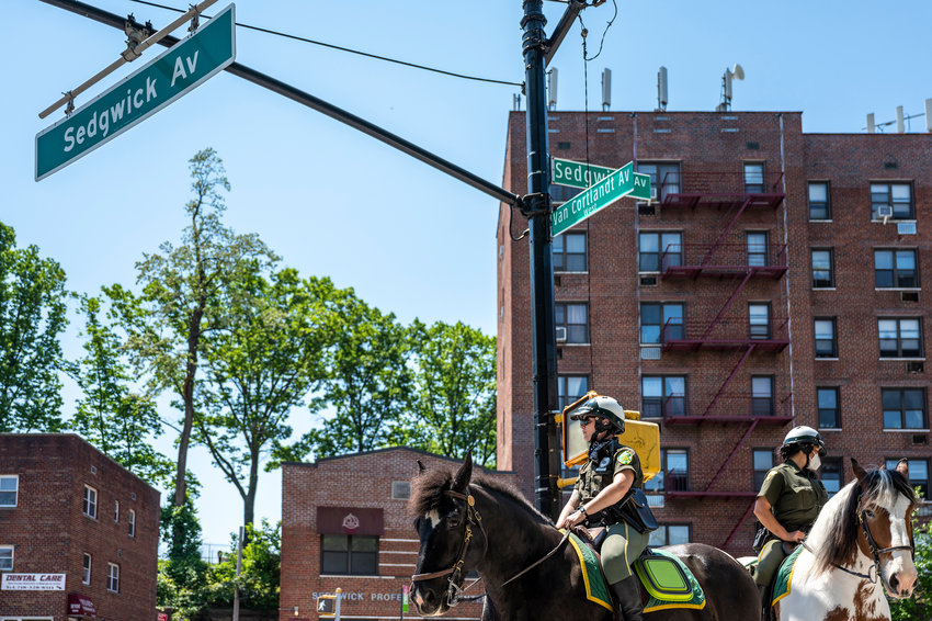 Mounted Parks Enforcement Patrol officers wait for the walkman at the intersection of Sedgwick Avenue and Van Cortlandt Avenue West.
