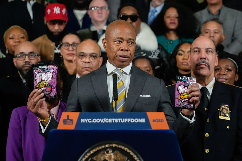 New York City Mayor Eric Adams, shown holding cannibis edibles, unveils an interagency task force headed by the city sheriff&rsquo;s office tasked with cracking down on the city&rsquo;s illegal smoke shops in a press conference at City Hall last December.