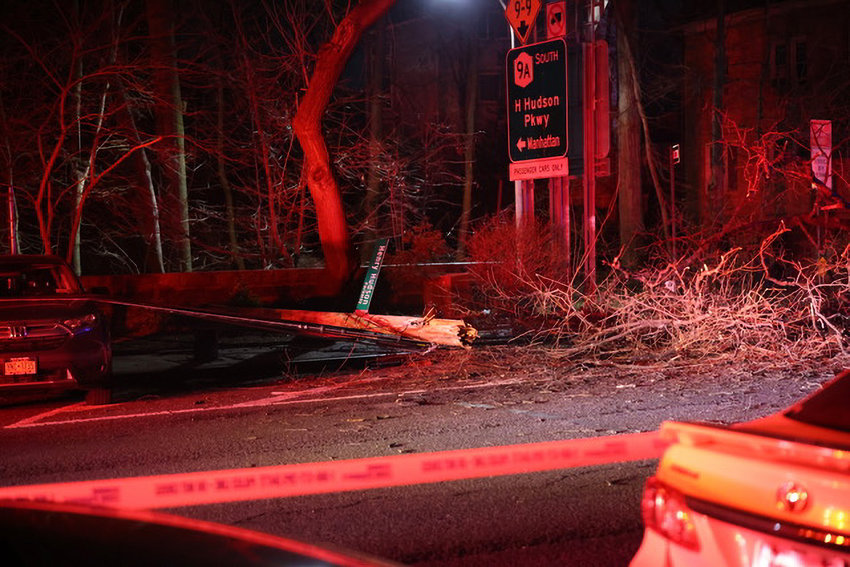 Dead branches and utility wires cover Fieldston Road on Monday night, Feb. 20, when a tree fell on overhead wires, triggering a fire.