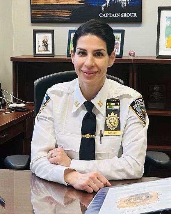 Capt. Filastine Srour, seated in her new office at the 50th Precinct&rsquo;s station house at 3450 Kingsbridge Ave. She grew in the Bronx, and spent the first 10 years of her policing career in the neighboring 52nd Precinct.