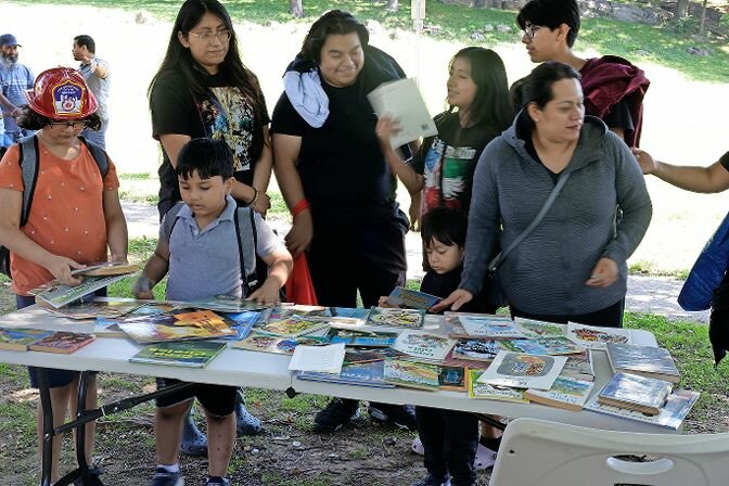 Kids and parents of all ages in the Bronx look around various tables at the back-to-school-fair and spot books from the former Saint Gabriel School&rsquo;s library of Riverdale that did not reopen this year as school started.&nbsp;The school merged with St. Margaret of Cortona.  &nbsp;