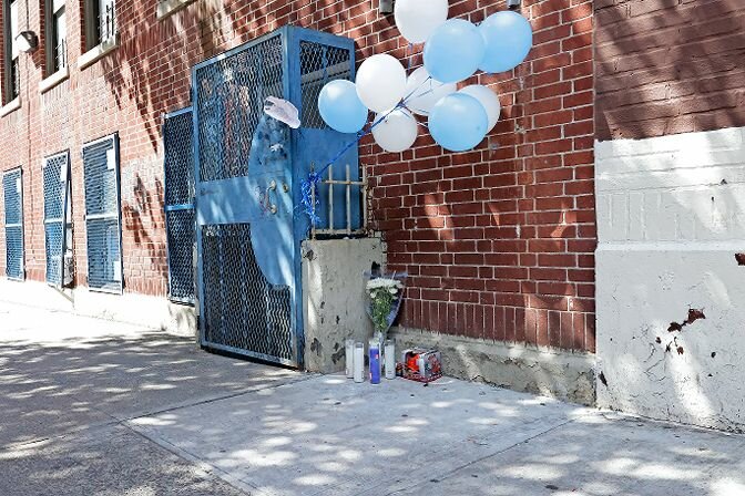The outside of Divino Nino Daycare on Morris Avenue has a couple of candles marking the death of 1-year-old Nicholas Dominici of Kingsbridge Heights. Police believe he died of a fentanyl overdose at the daycare center. Two other children were found unconscious.