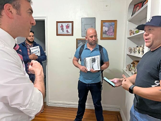 Councilman Eric Dinowitz and Joshua Stephenson, executive director at West Bronx Housing, met with tenants at 3045 Godwin Terrace, a rent-stabilized apartment that has a class one violation on Sept. 21. Rolando Ruiz has heard from people who have observed needles in the hallway and an air condition unit on the fire escape.