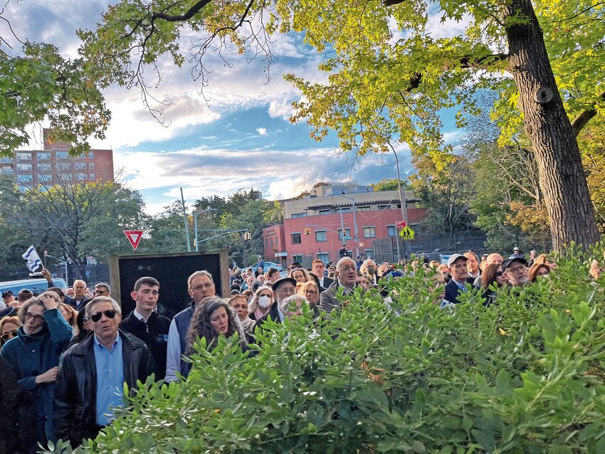 Community members and elected officials joined together in prayer on Simchat Torah, one day after the Hamas attack on Israel at the Bell Tower in Riverdale.