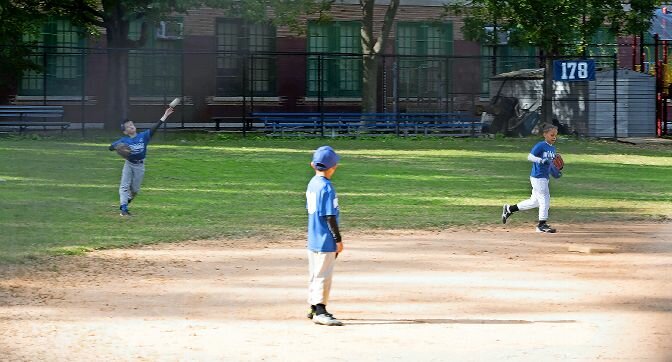 An outfielder in a North Riverdale Little League fall ball game gets the throw back into the infield in a game at the Mosholu Avenue field Tuesday. As the weather gets chillier, the fall baseball just starts heating up.