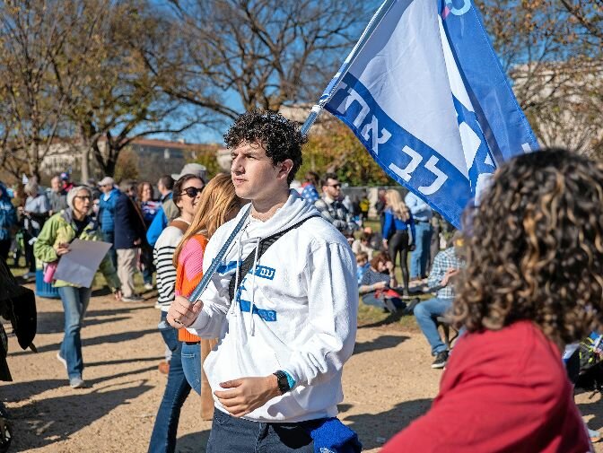 A student from SAR High School with flag marching in solidarity with Israel on Nov. 14.