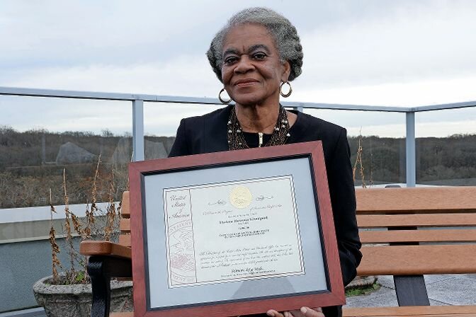 Thelma Liverpool with her patent plaque for her &ldquo;System For Collecting Body Waste of Non-Ambulatory Patients&rdquo; on Monday, Dec. 4. The device, &ldquo;the bed poti,&rdquo; allows people who are bedridden to use the restroom while in bed. It can also potentially be used as a bath.