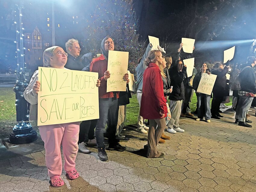 Student protesters gather on the Manhattan College campus on Tuesday evening. They are rallying in support of their tenured professors who are in danger of being separated from their jobs under new administrative changes.