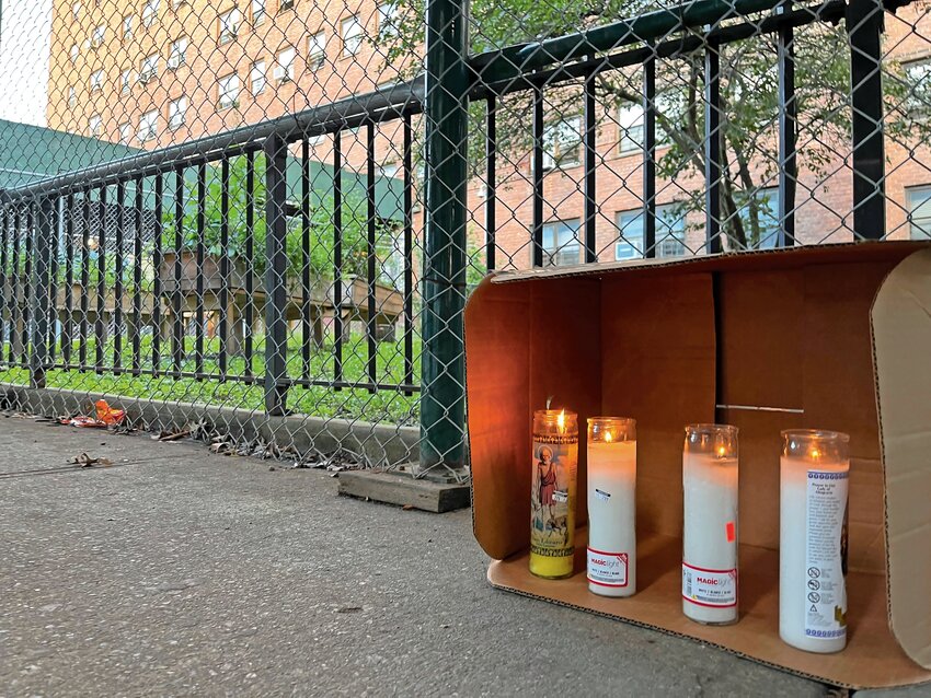 A candlelight vigil placed Sept. 13 sits on the spot where Juan Martinez, 44, was fatally stabbed in front of 130 W. 228th St. in Marble Hill on Sept. 12, 2023. Bryant Gonzalez, 36, of the Bronx was arrested on Sept. 26 and charged with murder, manslaughter and criminal possession of a weapon.