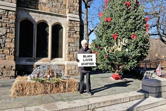 Carol Spivack, 88, holds a &lsquo;Black Lives Matter&rsquo; sign outside the Bell Tower Monument on Jan. 8. She began coming to the monument in May 2020 following the murder of George Floyd. For over three years she has come to the monument to bring awareness to issues in the world.