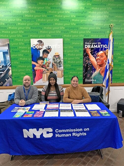 Orlando Torres, Tabytha Gonzalez, and Samelys Lopez from the city&rsquo;s Commission on Human Rights table at the Riverdale Y educate New York residents on their rights under the Human Rights Law.