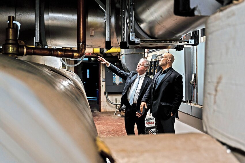 Dan Reingold, RiverSpring Living CEO and President, and John Lembo, vice president of facility management, tour the energy saving cogeneration system, CoGen, last year. Starting in April, Reingold will leave his RiverSpring Living position to head up River's Edge, a life plan community in Riverdale.