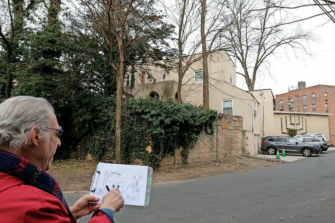 Joe Gordon, who lived across the street from the Denishawn House for years, takes a long look at the piece of history as he completes a sketch.