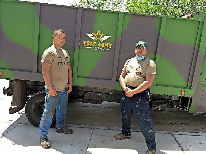 J.D. Santiago, a former employee, and Nick Lynch, co-owner and co-founder of Tree Army, ready to go out on a job. The veteran-owned company is true to its name. Dressed for the part, workers tackle the many arbor-related problems and needs of greater Riverdale neighbors and businesses.