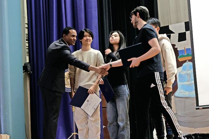 U.S. Rep. Ritchie Torres of the 15th Congressional District shakes hands with Matthew Greenspun. Greenspun created an app that won a congressional award while in attendance at Bronx High School of Science.