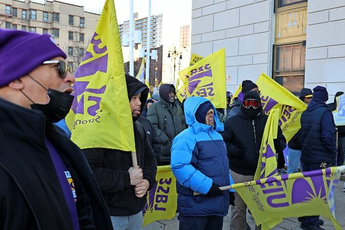 Union members of the 32BJ SEIU gathered on the steps of the Bronx Supreme Court last week after members voted to authorize a strike if the Bronx Realty Advisory Board reopens their contract on Monday. Members argue the realty board is attempting to lower their standards and health benefits.