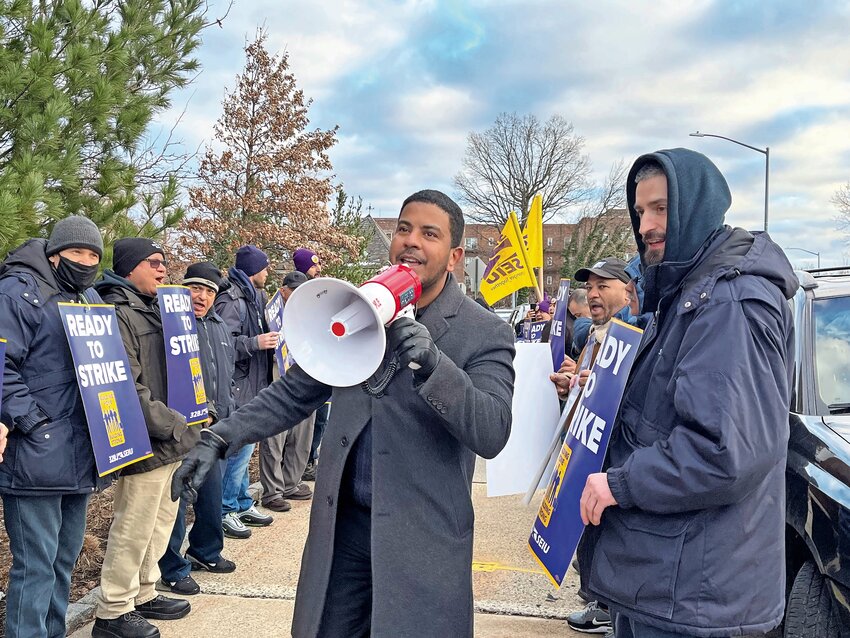 Aneury Rodriguez uses a megaphone to get his fellow union workers going with some words of inspiration in front of Skyview Riverdale last month. The union representing workers like him chose not to go on strike after the Bronx Realty Advisory Board opted not to re-open an already completed contract.