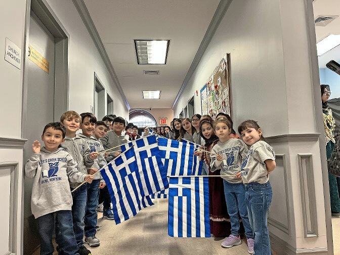 St. Peter the Apostle Greek Orthodox Church School students line the hall and proudly display their flags in celebration of Greek Heritage Month. Greece officially declared its independence from the Ottoman Empire March 25, 1821.
