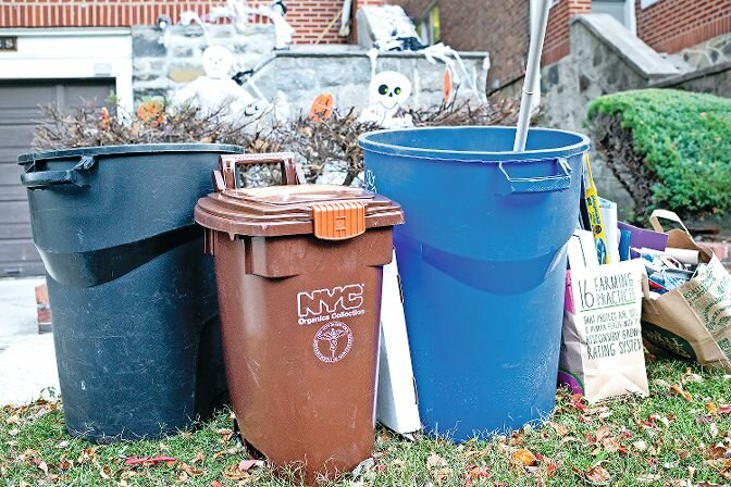 Photo by Adrian Fussell -- Compost bins at residential homes along Delafield Avenue in North Riverdale on Oct. 30.